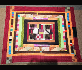 Quilt made by Olive Barrett and Lisa Jackson.